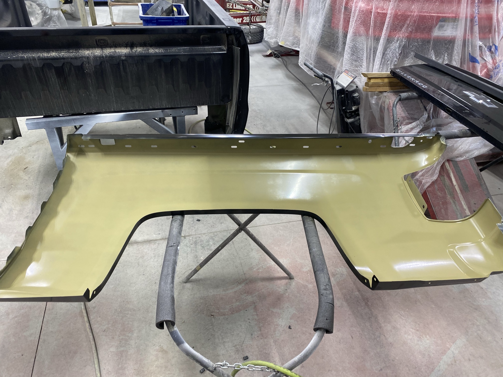 Replacement truck body panel prepared for refinishing
